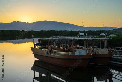 Pleasure boats in the bay at dawn. Ras al Khaimah emirate viewin the northern United Arab Emirates cityscape landmark 
