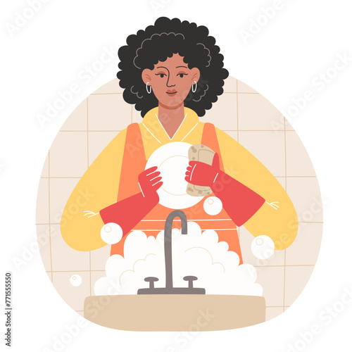 African woman washing dishes in a cozy kitchen