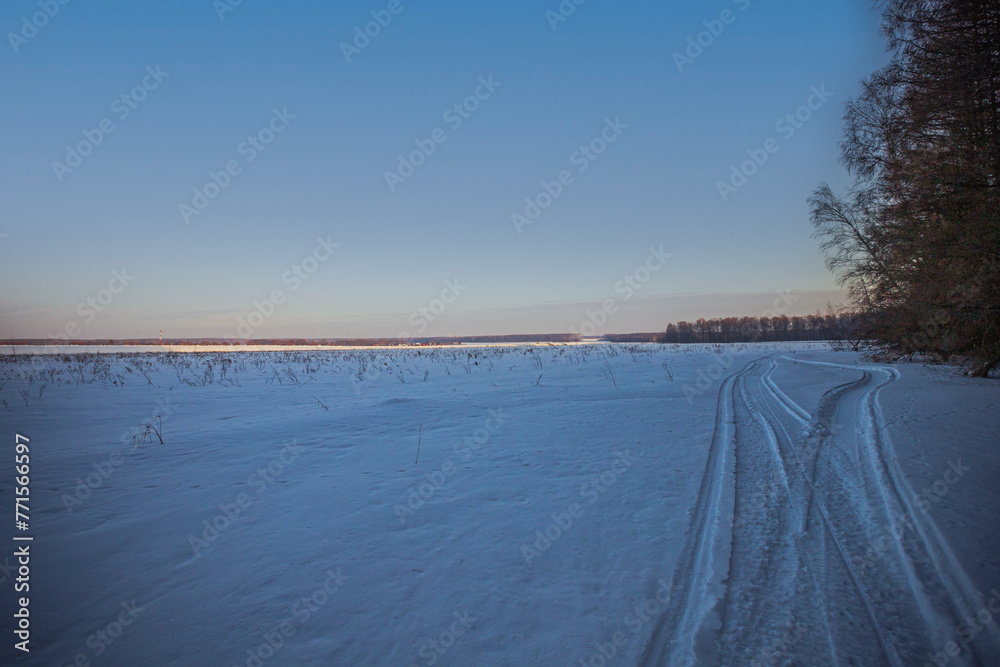 the trail of a snowmobile in the impassable snows of winter nature the trail of a snowmobile in the impassable snows of winter nature