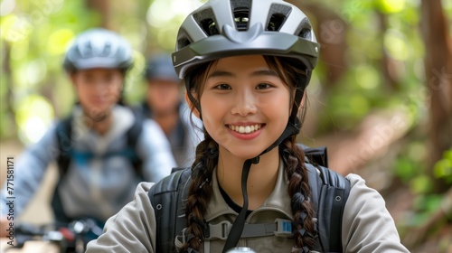Smiling Female Cyclist Leading a Mountain Bike Trail Ride