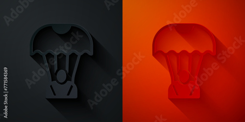 Paper cut Parachute icon isolated on black and red background. Paper art style. Vector