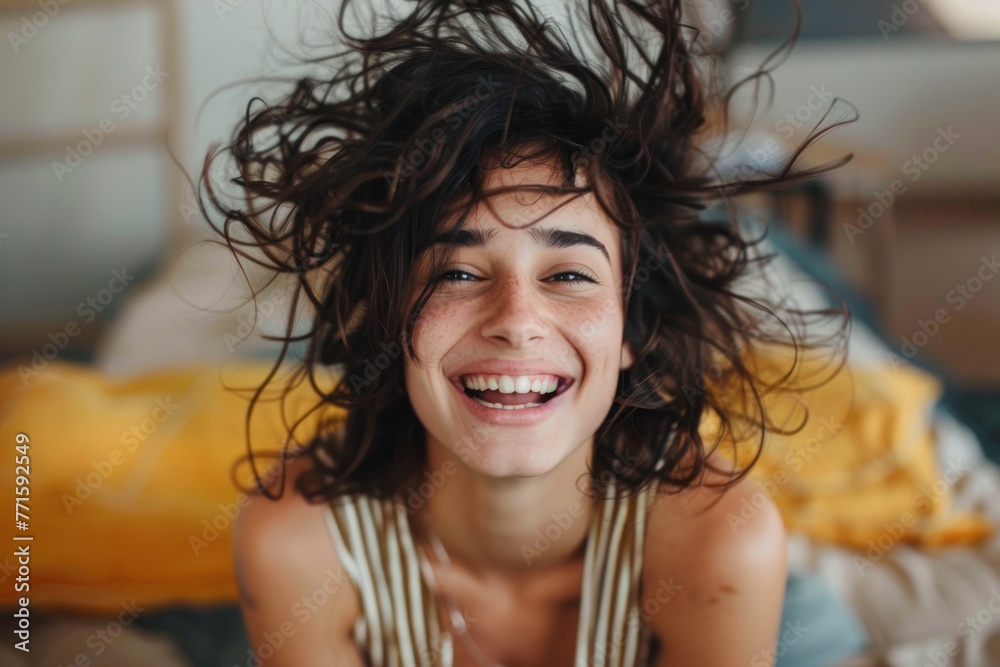 cheerful young woman with messy hair smiling wide cheerful young woman with messy hair smiling wide