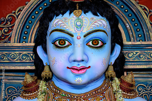 Idol of Goddess Laddu Gopal or little Lord Krishna at a decorated puja pandal in Kolkata, West Bengal, India. photo