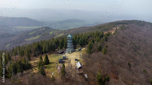 Wielka Czantoria and Mala Czantoria hill in Beskid Slaski mountains in Poland. Observation tower in the mountains during early spring day. photo