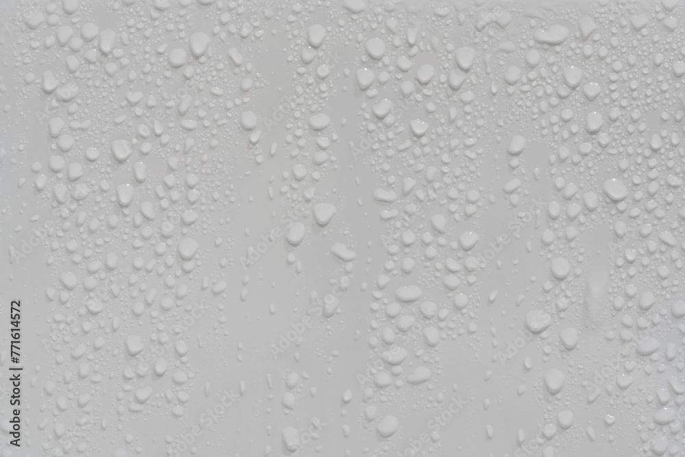 Water drops on white background texture. backdrop glass covered with drops of water. grey bubbles. condensate Water drops on white background texture. backdrop glass covered with drops of water. grey bubbles. condensate
