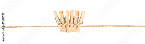 wooden clothespins on clothesline isolated white background. household сlothes pins on a jute rope
