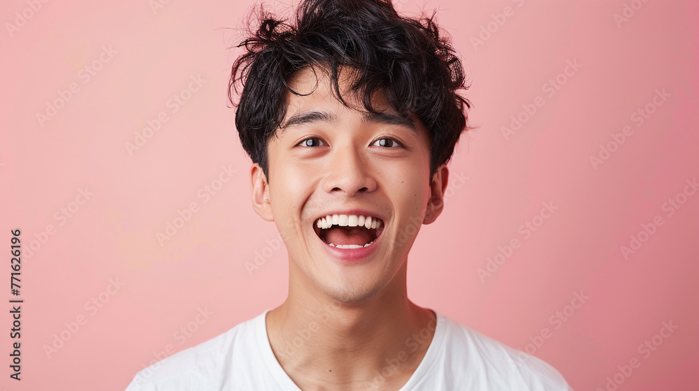 Fototapeta premium A playful and surprised young white man looking at the camera with a joyful expression