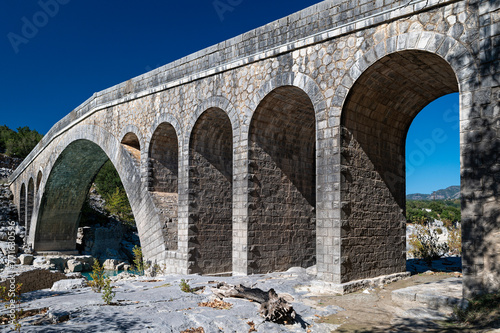 View of a the stone bridge of Templa, built in 19th century, one of the finest samples of traditional architecture in Central Greece © dinosmichail