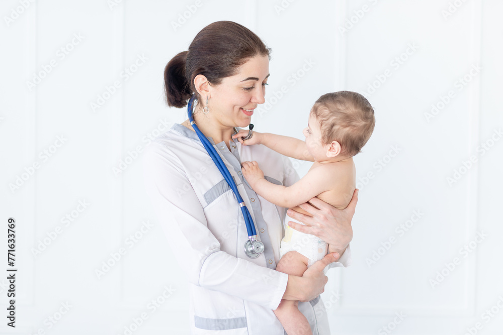 pediatrics, a doctor examines a baby boy, the concept of medicine and health pediatrics, a doctor examines a baby boy, the concept of medicine and health