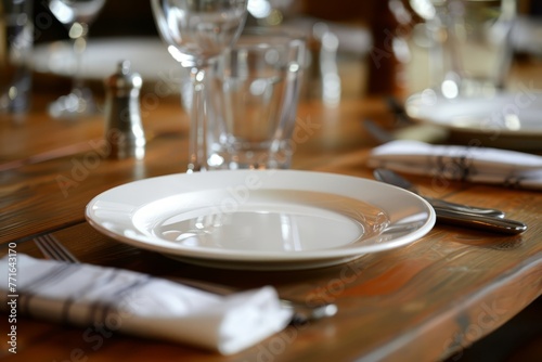 A white plate is placed neatly on a wooden table, creating a simple yet elegant composition