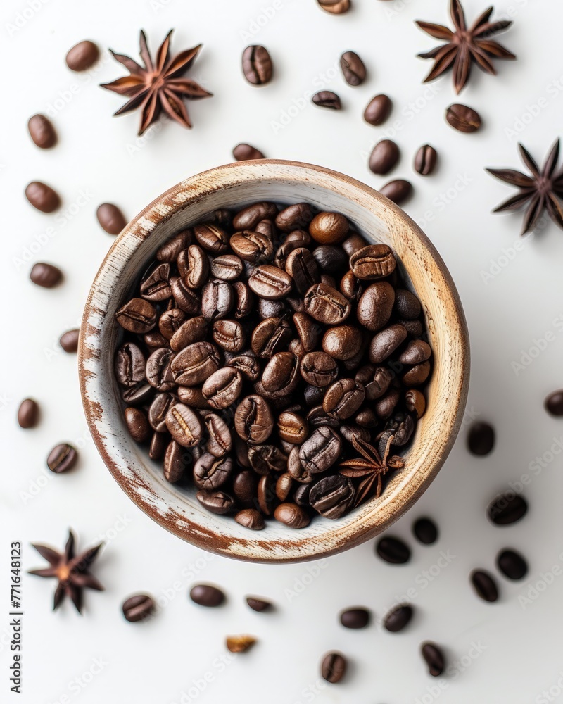 Fototapeta premium A bowl containing a mixture of coffee beans and star anise, creating a fragrant and visually appealing display