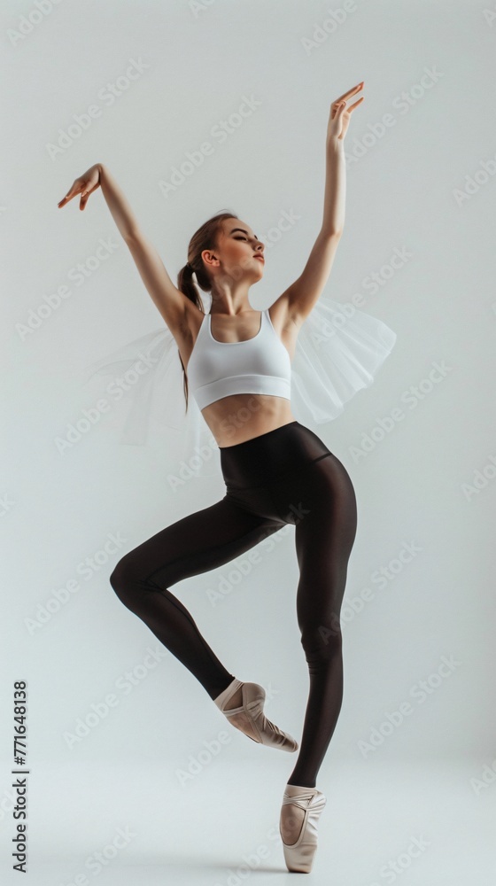 Woman doing ballet, studio photo