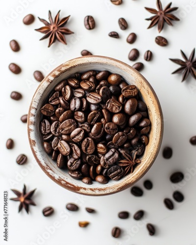 A bowl containing a mixture of coffee beans and star anise, creating a fragrant and visually appealing display