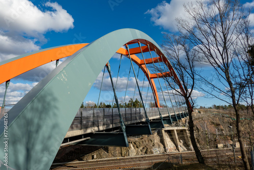 Stockholm, Sweden An orange-colored bridge over the railroad tracks in the Vasteberga suburb. © Alexander