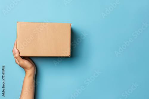 person holding a cardboard box
