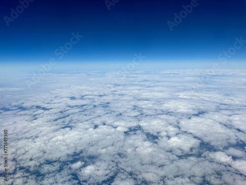 White cumulus clouds on clear blue sky background closeup, overcast skies backdrop, fluffy cloud texture, beautiful sunny cloudscape heaven, ozone layer illustration, scenic cloudy weather