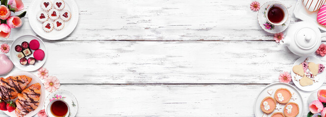 Mother's Day tea double border against a white wood banner background. Assorted sweet desserts and pastries. Copy space.
