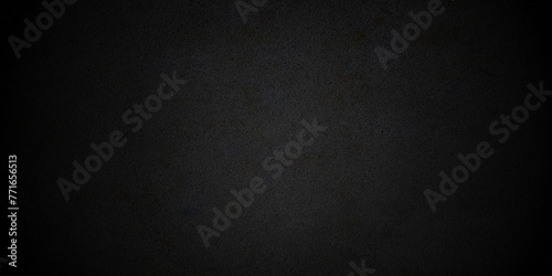 Textured grunge dark black concrete wall background. Closeup of textured concrete wall.