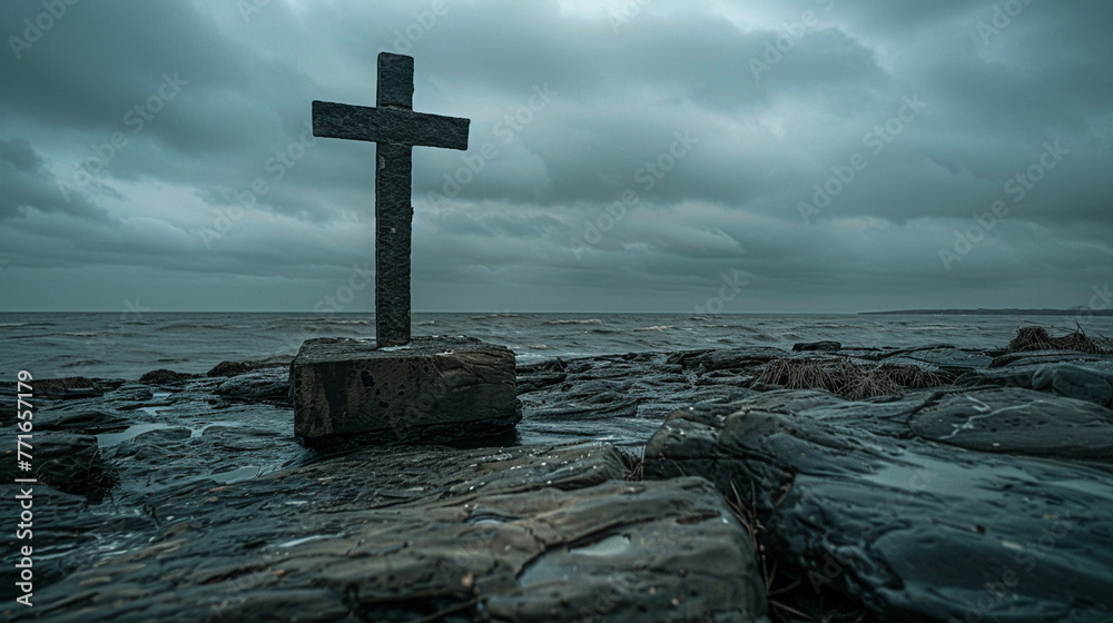 A Bible and a simple cross on a rocky shoreline the overcast sky creating a dramatic and moody atmosphere A Bible and a simple cross on a rocky shoreline the overcast sky creating a dramatic and moody atmosphere