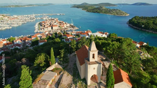 St. Nicholas church and the old town of Tribunj in Dalmatia region of Croatia photo