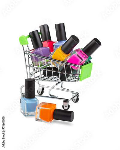 Mini shopping cart with several coloured bright nail polish bottles