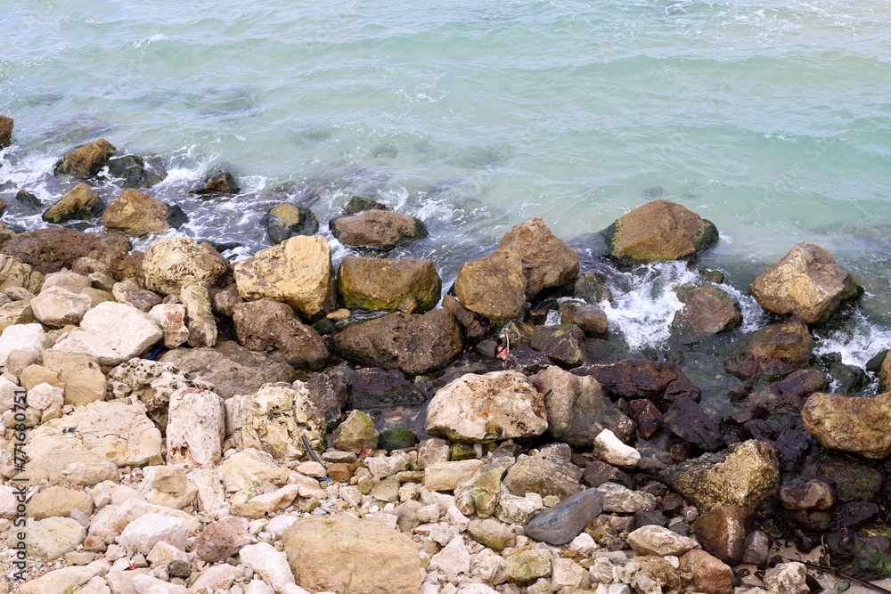 Stones and shells on the shore of the Mediterranean Sea.