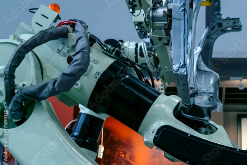 Abstract industry background featuring details of industrial robots in assembling line in Japan