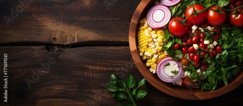 A basket filled with leaf vegetables and fruits, placed in a wooden bowl on a table. A natural foods dish ready to be used in a recipe