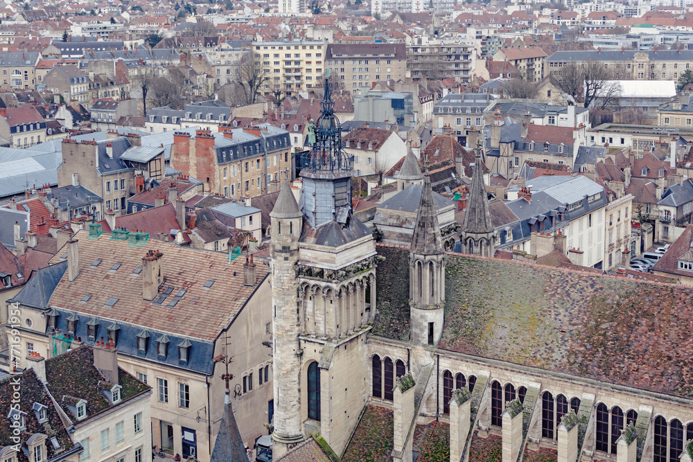 Dijon urban panorama background featuring details of city downtown in dark day in January. 