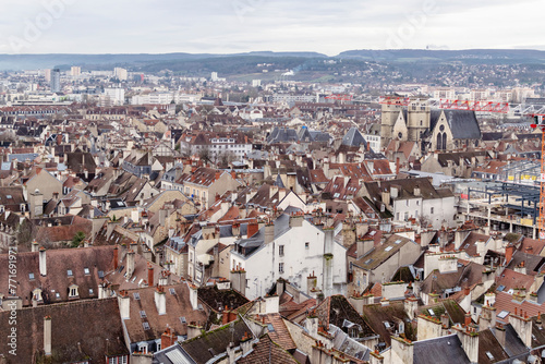 Dijon urban panorama background featuring details of city downtown in dark day in January. 