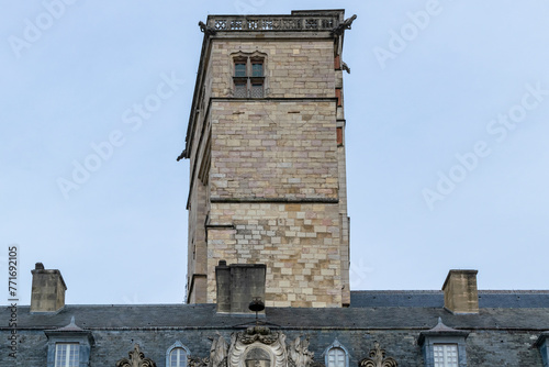 Vintage urban background featuring detail of the Philip the Good medieval Tower in Dijon, France.