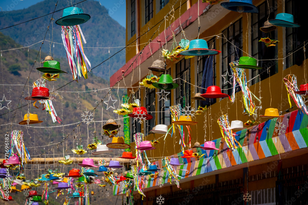 Colorful hats strung above the streets of Lake Atitlan.