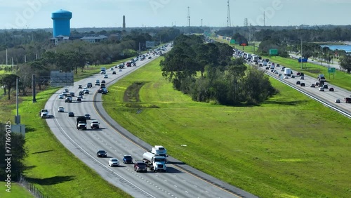 View from above of busy american highway with fast moving trucks and cars. Interstate transportation concept