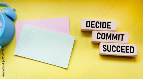 Decide Commit Succeed concept word on wooden blocks. Stickers for writing. The business solution is committed to success.