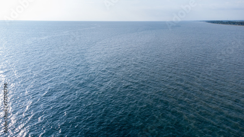 The boundary between clean and turbid water in the middle of the sea. Patobong, South Sulawesi Indonesia. March 30 2024