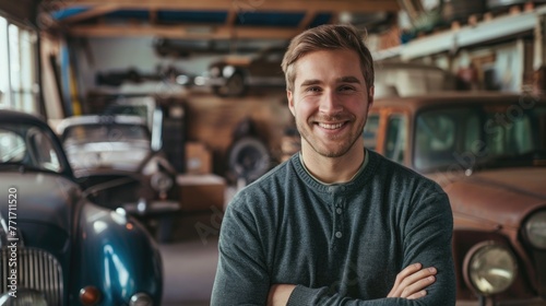 Portrait smiling young man with vintage car garage © romanets_v