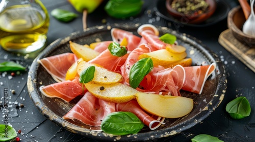  A platter of thinly cut apples, pears, and prosciutto served on a table, accompanied by a bottle of olive oil