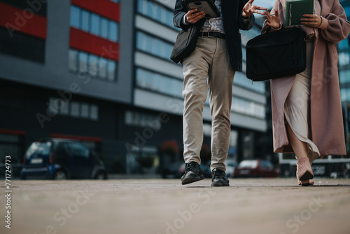 Business partners or colleagues in an urban city area networking and discussing strategies for business expansion and growth.