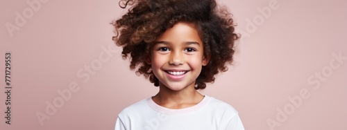 Portrait of a little happy cute child with curly hair 