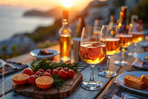 An idyllic dining setup featuring wine glasses and fresh ingredients, overlooking the Mediterranean Sea at sunset © Larisa AI
