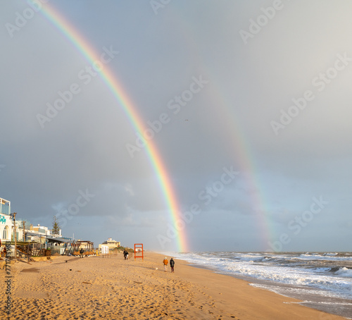 duplo arco iris na praia
