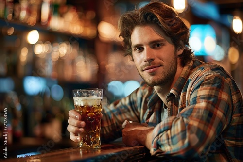 Man Sitting at Bar With Glass of Beer