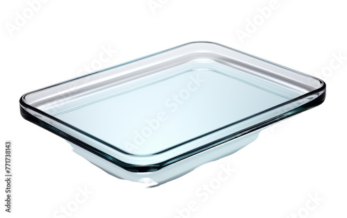 A glass casserole dish gleams on a pristine white background