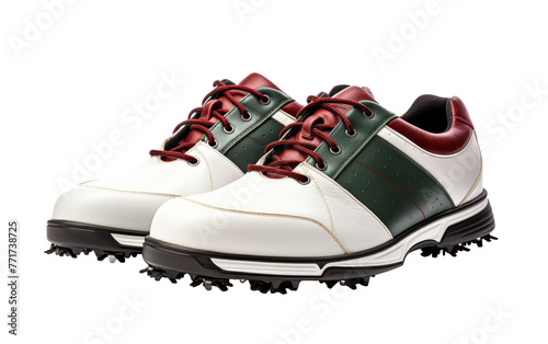 A stylish pair of white and green golf shoes standing on lush green grass