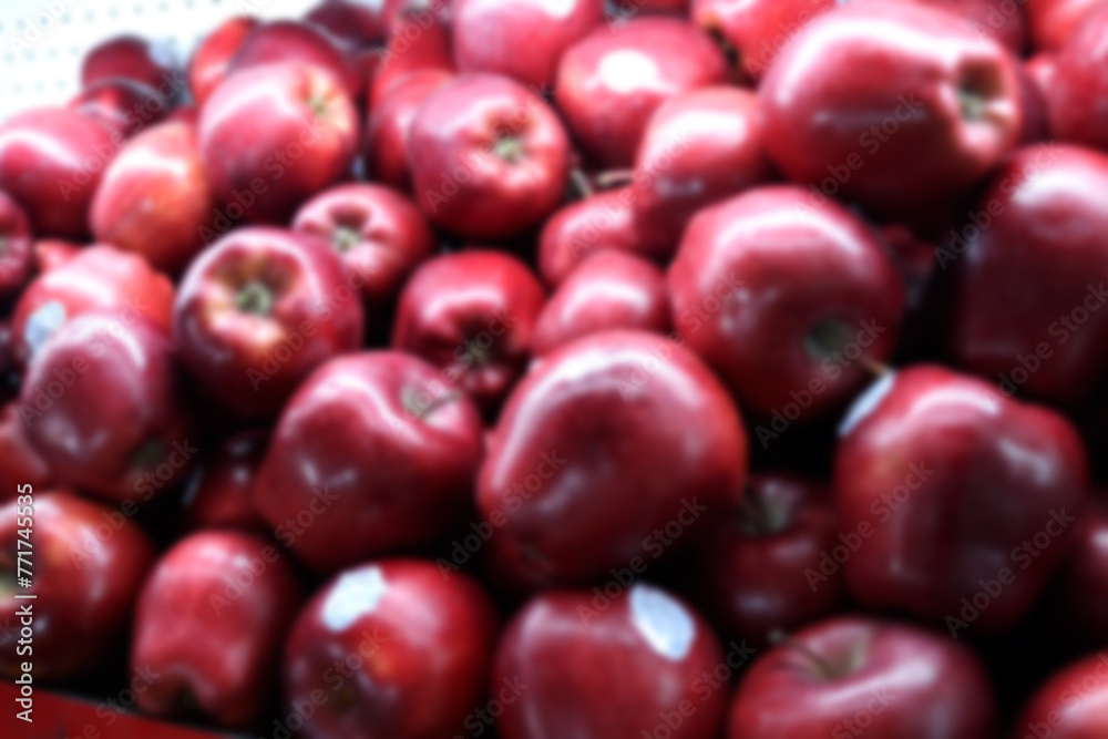 Blur photo Pile of maroon colored apples at the fruit market Blur photo Pile of maroon colored apples at the fruit market