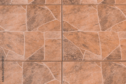 Close-up brown abstract stone pattern mosaic floor tiles texture background structure