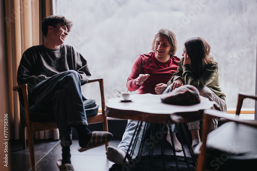 Three friends enjoying a comfortable conversation while relaxing in a cozy home setting, with warm and inviting tones.