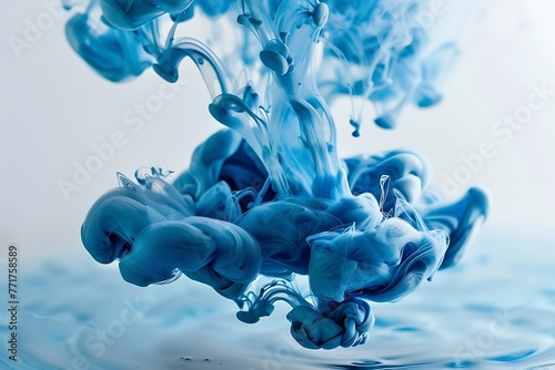 Blue ink in water on a white background. Blue ink in water on a white background