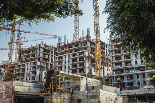 Building cranes on construction site in Tel Aviv city, Israel