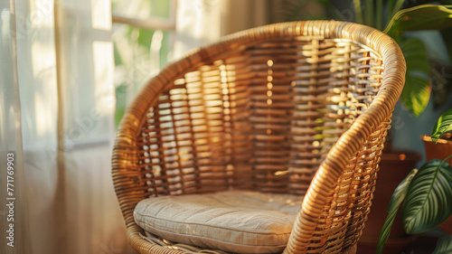 A wicker chair with a cushion in a room.